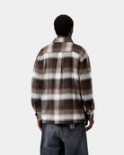 Carhartt WIP L/S Esterson Shirt in Esterson Check, Tobacco, shown from the back with an allover check pattern and woven Square Label at the hem, shown on model.