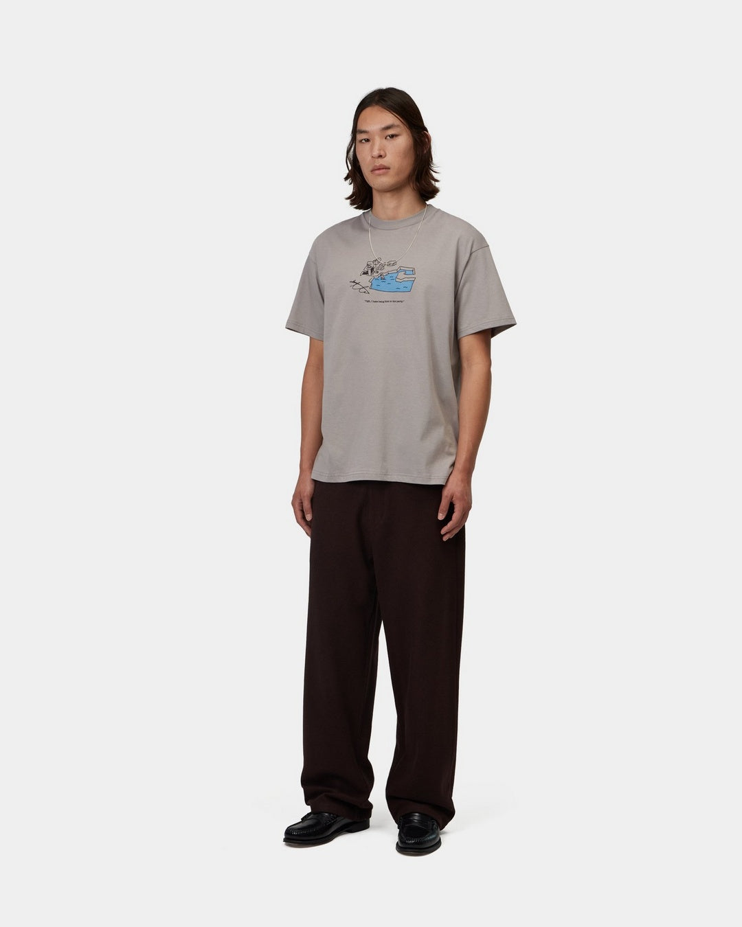 Carhartt WIP S/S Ice Fishing T-Shirt in Shady Grey, front view with graphic print on the chest, shown on model.