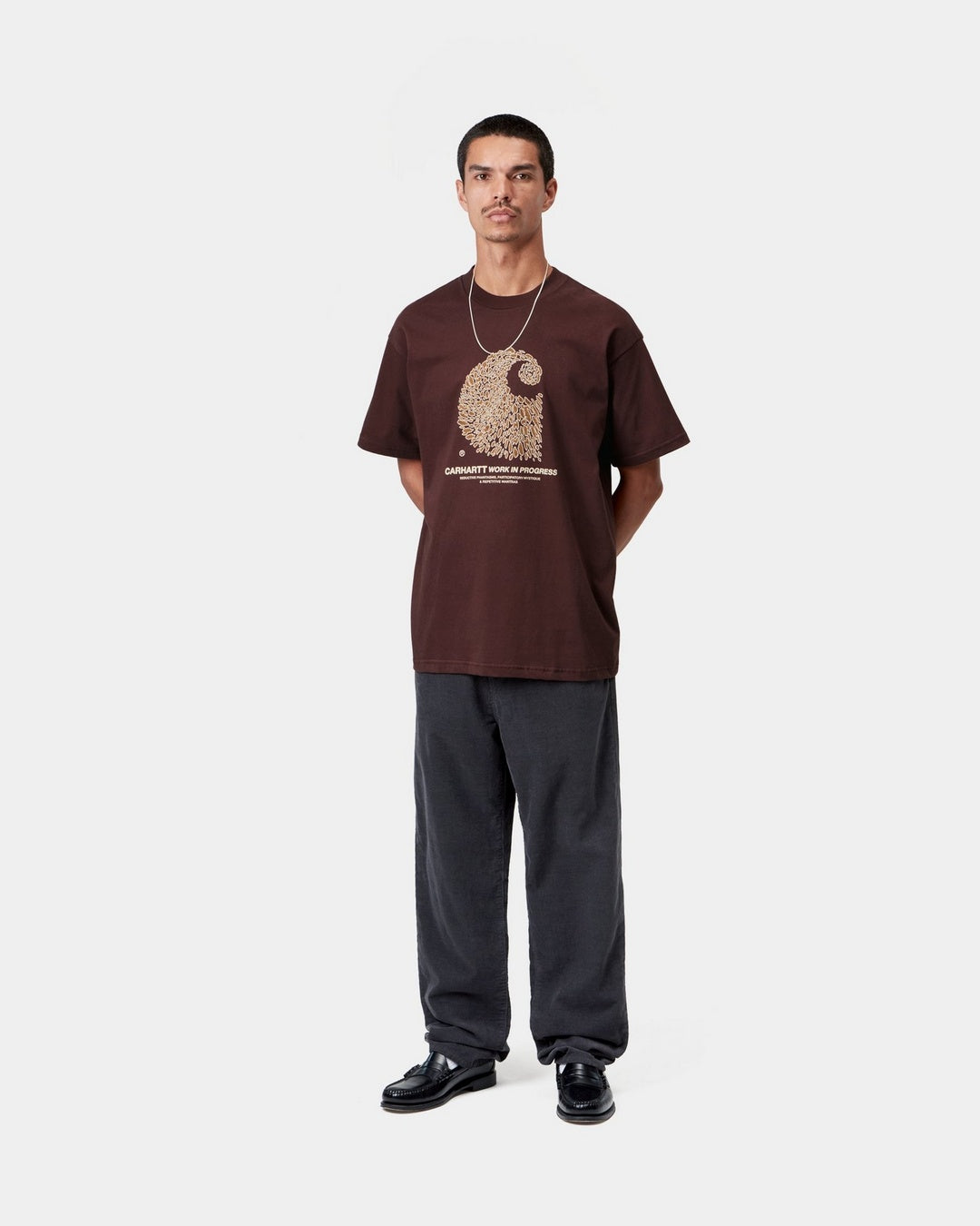 Carhartt WIP S/S Entrance T-Shirt in Amarone, front view on a model, with graphic print on the chest.
