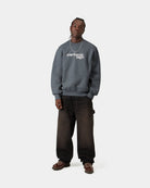 Carhartt WIP Wireless Sweat in Styx / Wax, front view with logo graphic on the chest, shown on model.