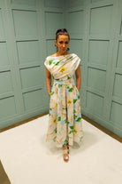 Front view of Betty blue floral midi dress with asymmetric neckline