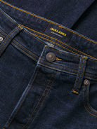 Close-up of dark wash denim on Jack and Jones bootcut jeans
