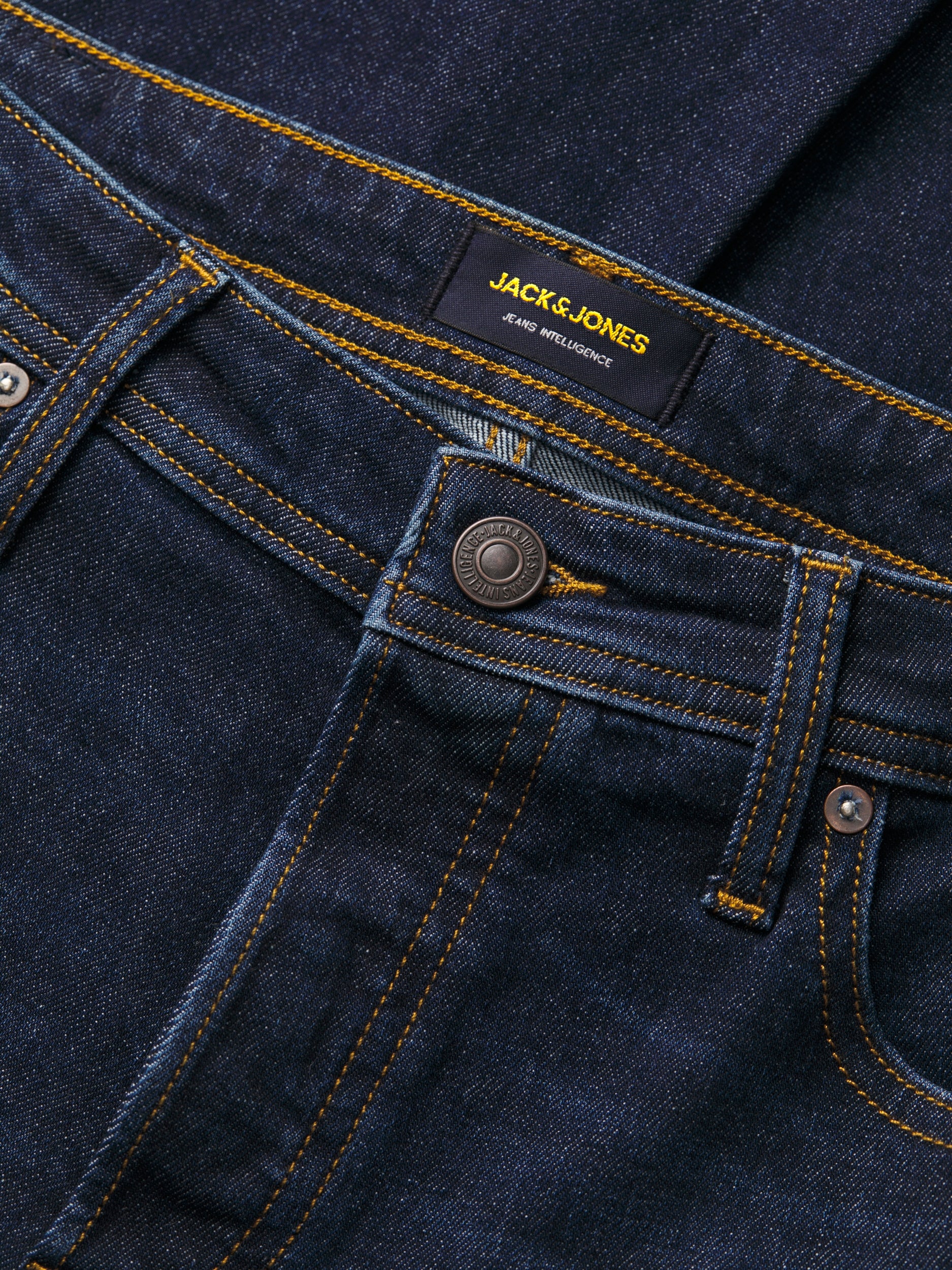 Close-up of dark wash denim on Jack and Jones bootcut jeans