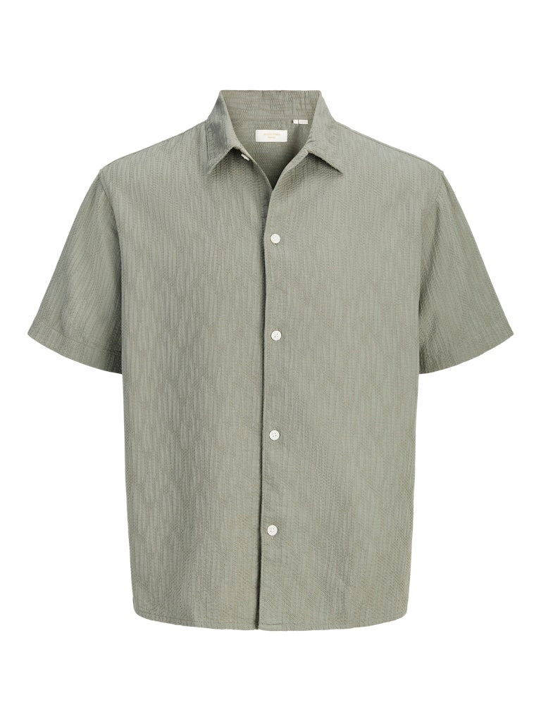 Green short-sleeve shirt on a white background