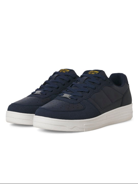 Pair of navy blue sneakers on a white background