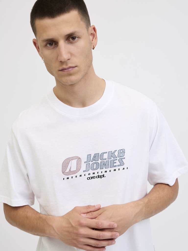 Man wearing a white 'Jack & Jones' t-shirt on a plain background