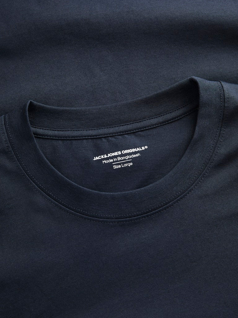 Close-up of a navy blue t-shirt with a brand label on the collar.