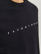 Black sweatshirt with 'Jack & Jones' logo on a light gray background