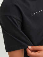 Black t-shirt with 'JACK & JONES' text on a plain background