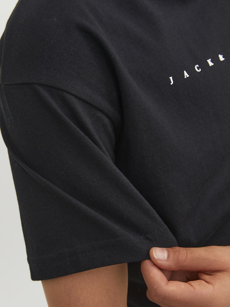 Black t-shirt with 'JACK & JONES' text on a plain background