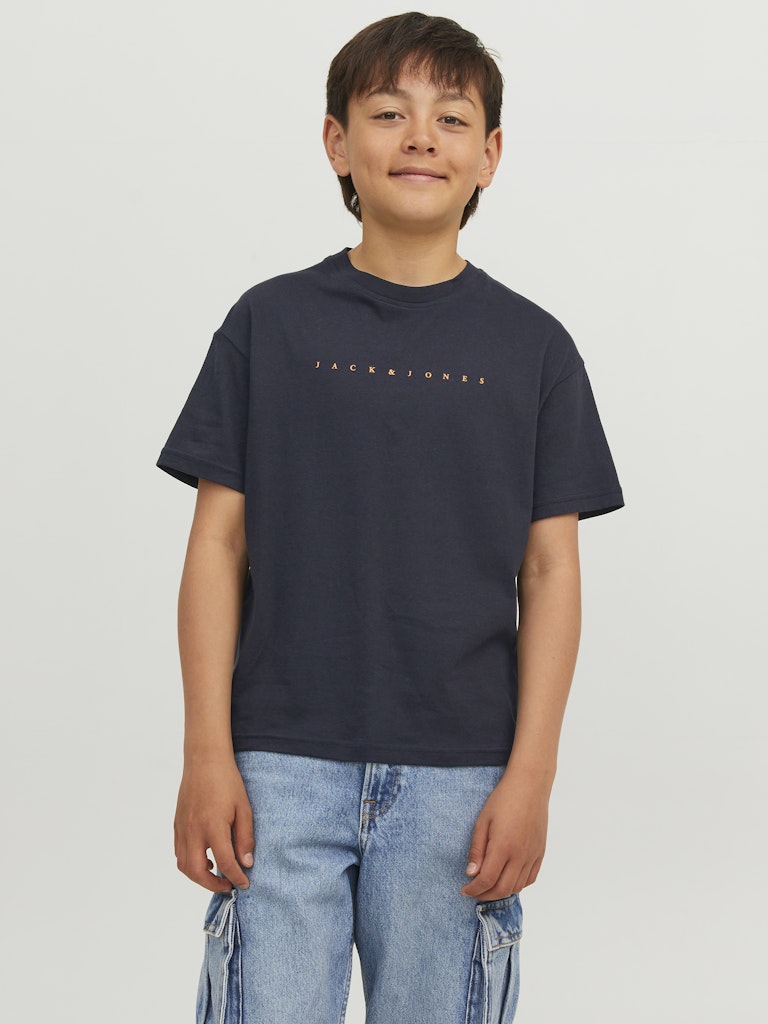 Child wearing a navy t-shirt with 'Jack & Jones' logo on a plain background