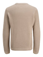 Beige ribbed sweater on a white background