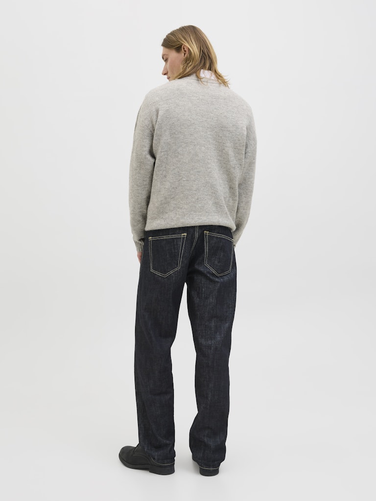 Person wearing a gray sweater on a white background back view
