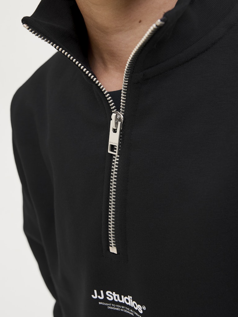 Black zip-up hoodie with 'JJ Studios' logo on a white background