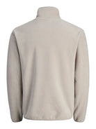 Beige fleece jacket on a white background