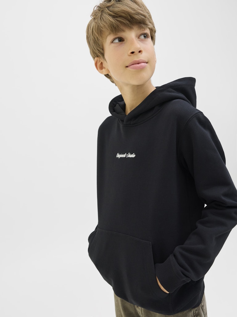 Person wearing a black hoodie with a logo on a white background