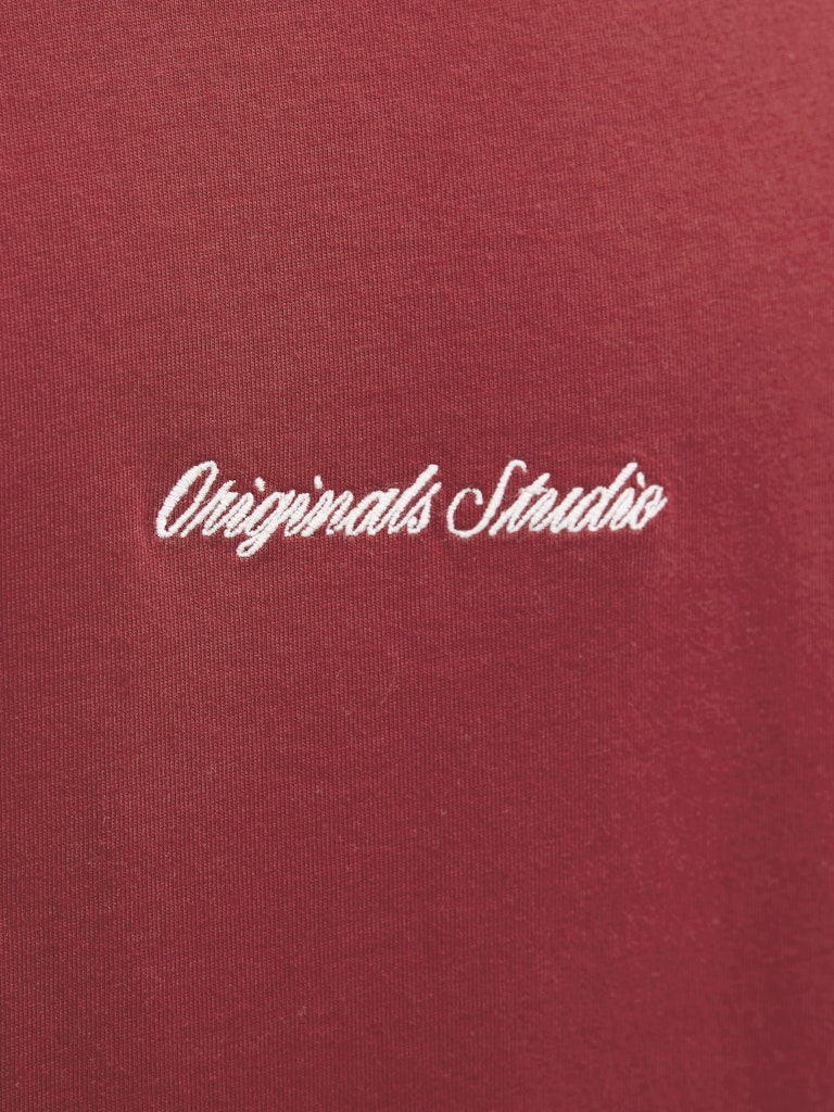 Red fabric with 'Originals Studio' embroidered in white