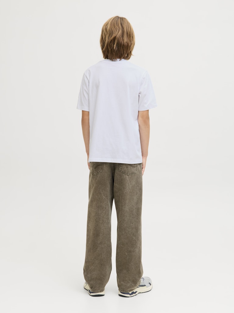 Person wearing a white t-shirt and brown pants on a plain background