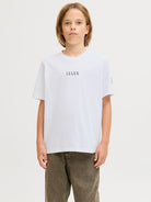 Person wearing a white 'Jack & Jones' t-shirt on a plain background