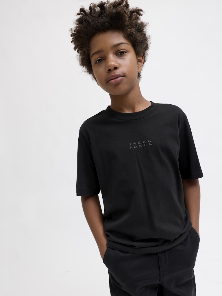 Child wearing a black t-shirt with a logo on a white background