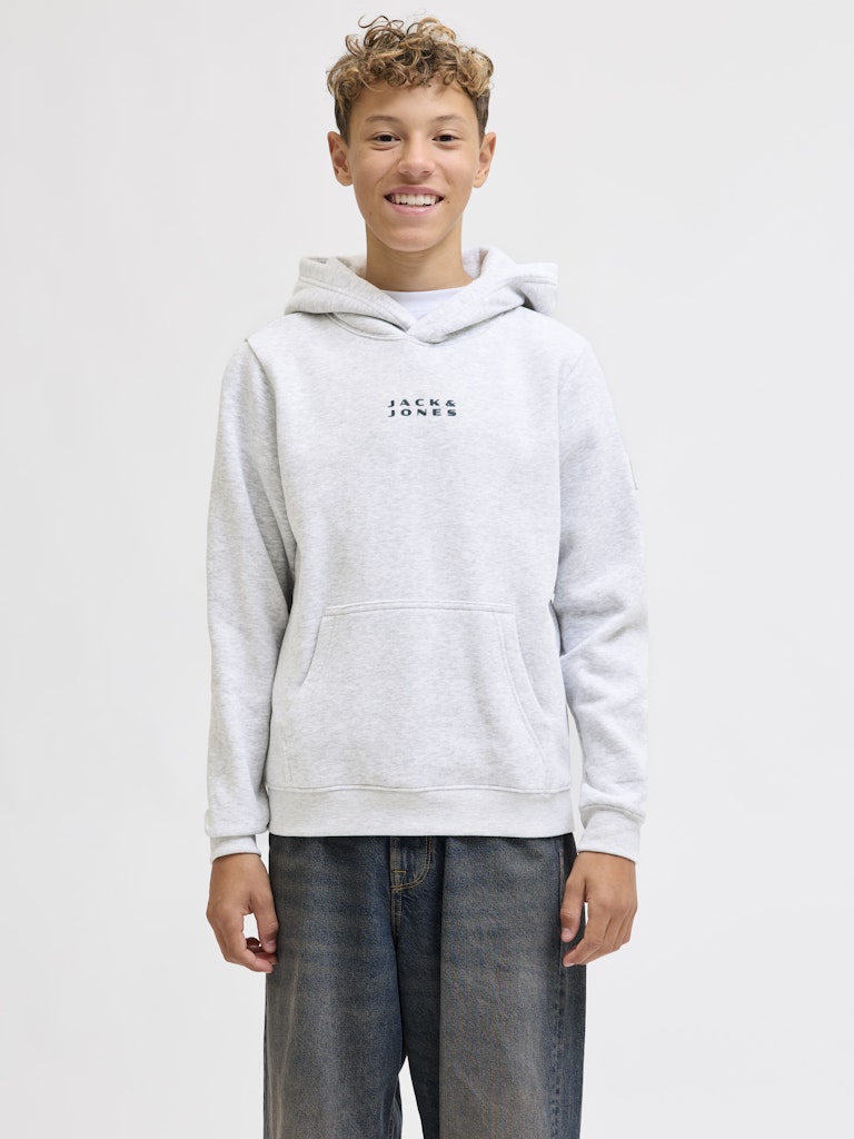 Person wearing a gray hoodie with 'Jack & Jones' logo on a white background