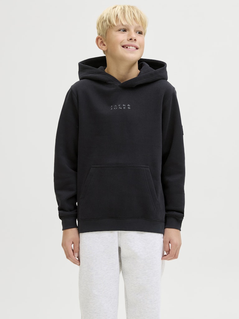 Child wearing a black hoodie with a brand logo on a white background