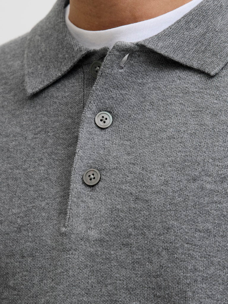 Gray polo shirt with buttons on a neutral background