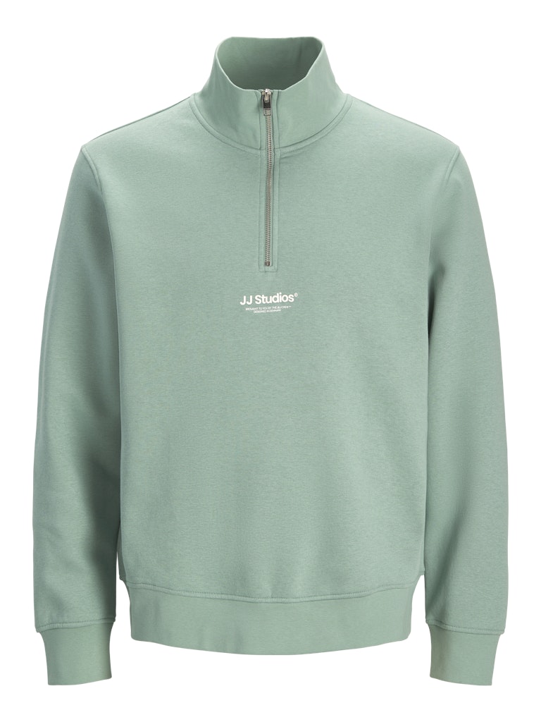 Light green sweatshirt with a quarter zip on a white background