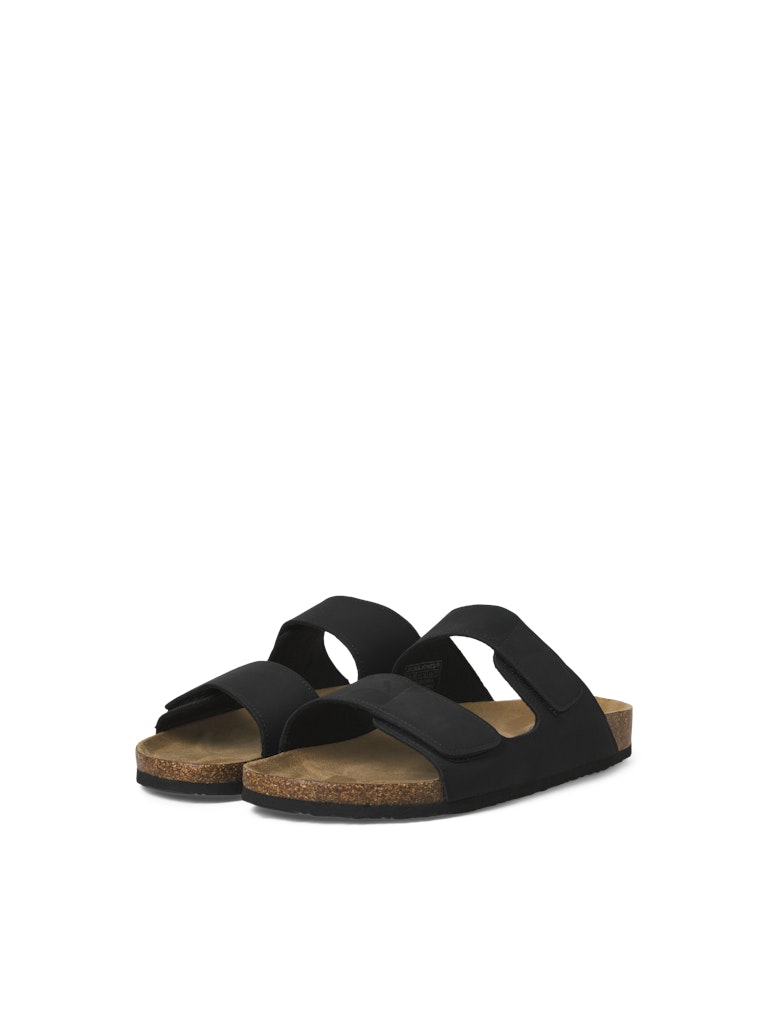 Black sandals with cork sole on a white background