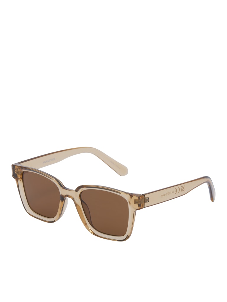 Sunglasses with a beige frame and brown lenses on a white background