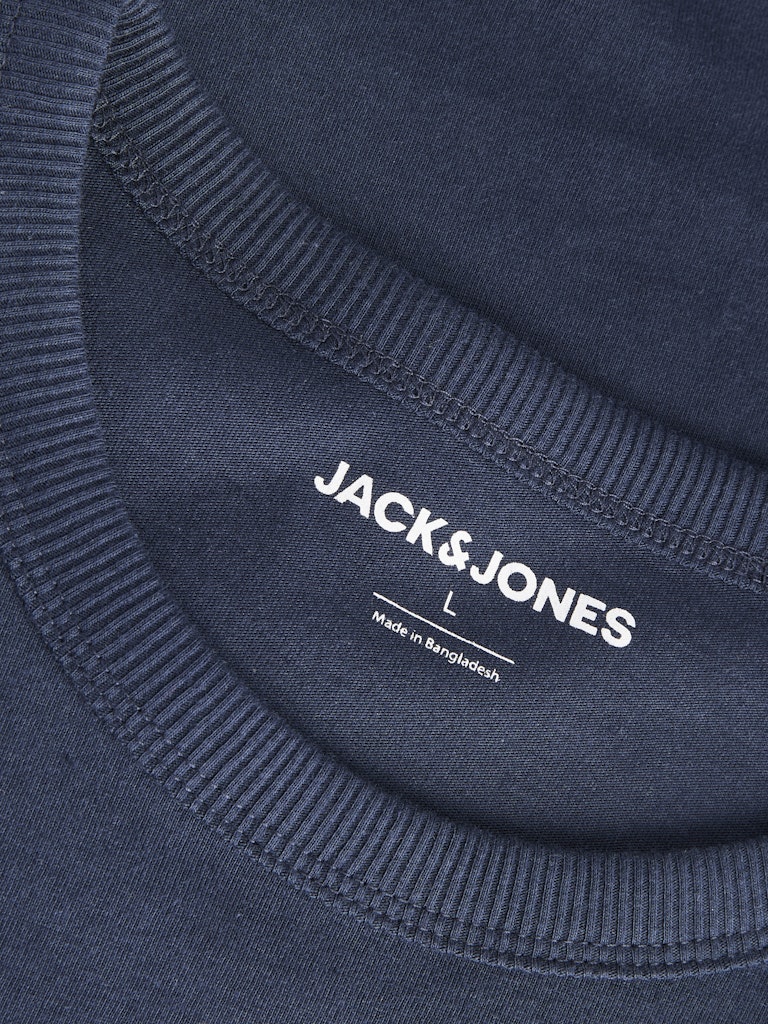Close-up of a navy blue t-shirt with 'Jack & Jones' branding and 'made in Bangladesh' text.