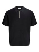 Black polo shirt with a zipper on a white background