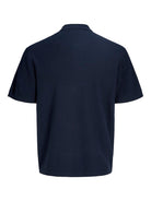Navy blue polo shirt on a white background