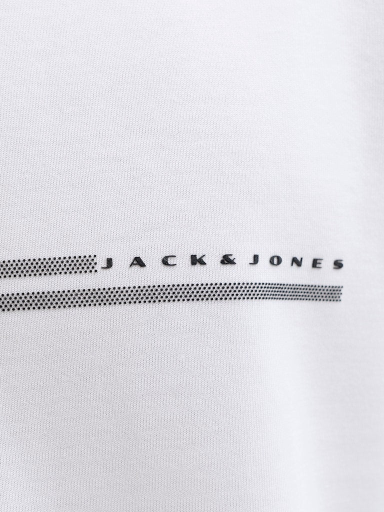 Close-up of a white shirt with 'Jack & Jones' logo on a light gray background