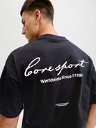 Person wearing a black t-shirt with 'Coresport' branding on the back.