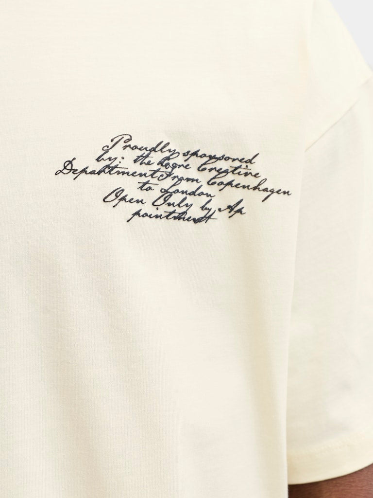 Text on a white shirt with black ink