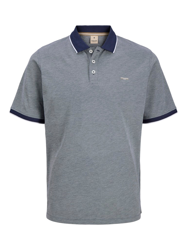 Blue polo shirt with navy collar and trim on a white background