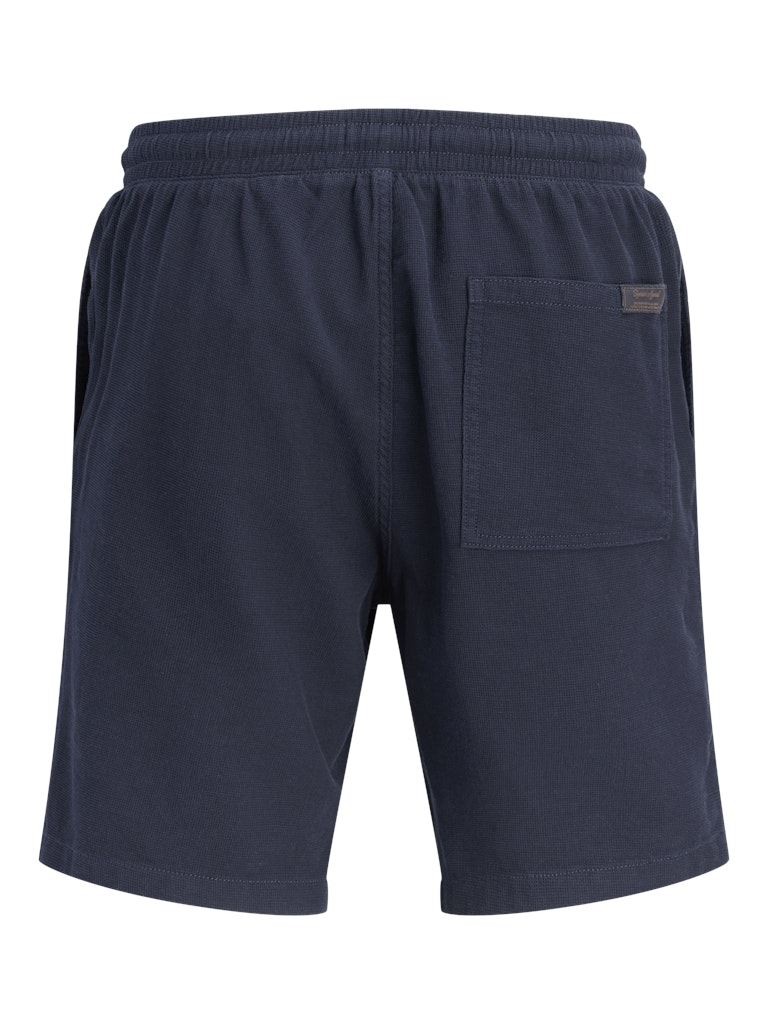 Navy blue shorts with a pocket on a white background