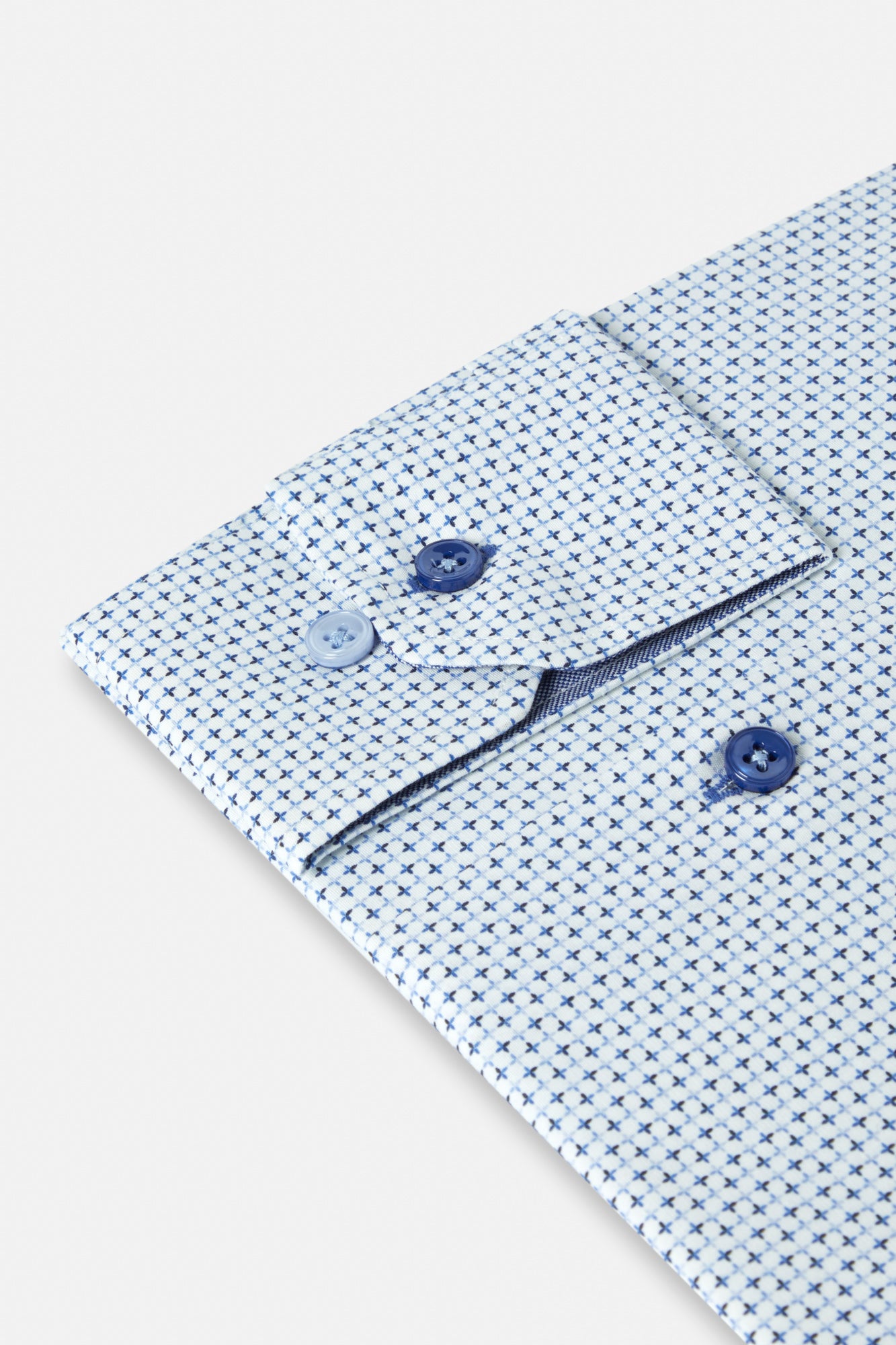 Close-up of a light blue patterned shirt with white background