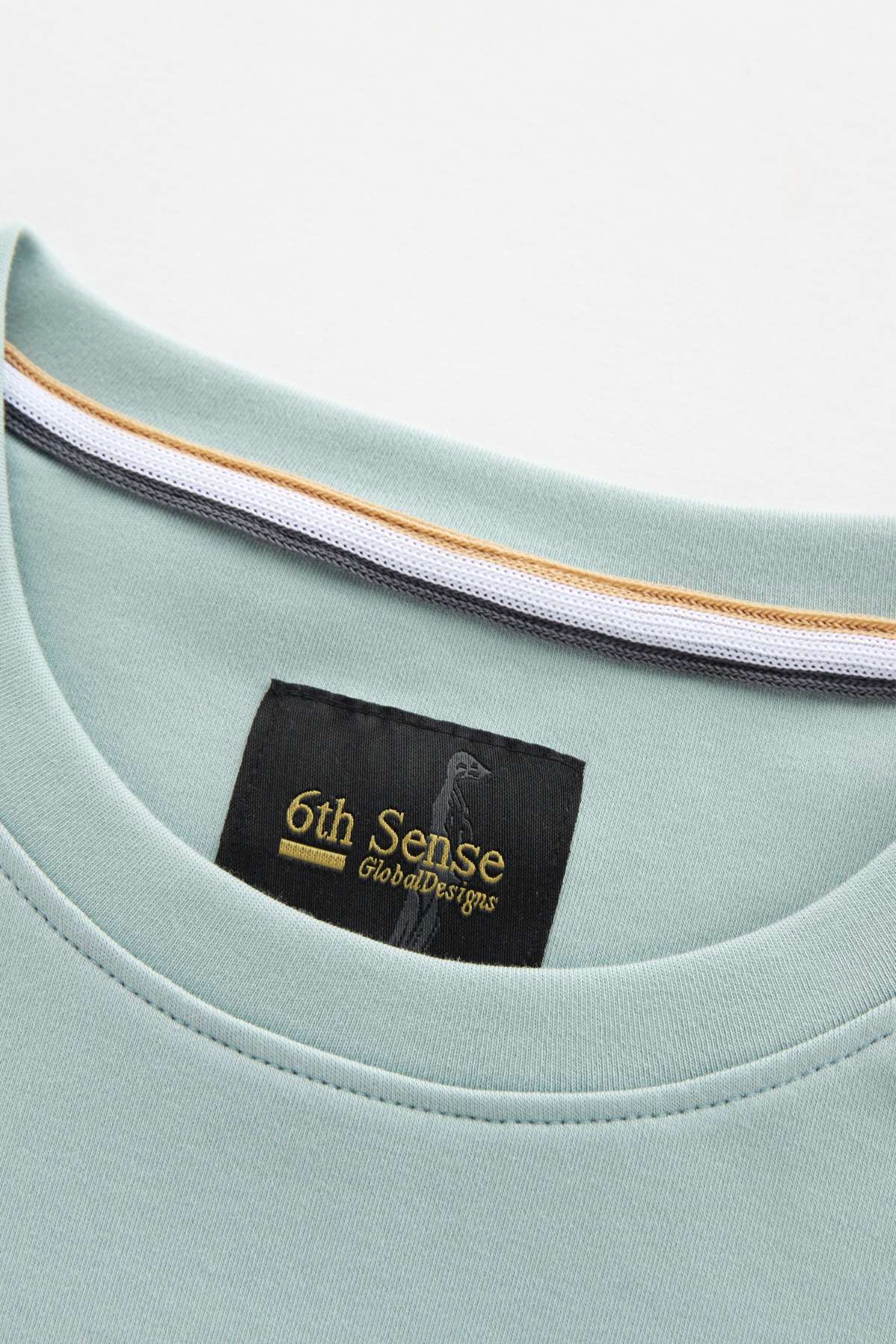 Light blue shirt with a '6th Sense' label on a white background