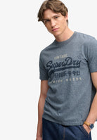 Superdry Vintage Logo Heritage Relaxed Tee in Denim Blue Marl angled model view