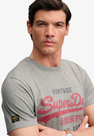 Superdry Vintage Logo Heritage Relaxed Tee in Dark Vintage Grey Marl angled model view
