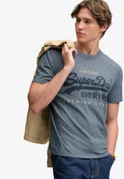 Superdry Vintage Logo Heritage Relaxed Tee in Denim Blue Marl angled model view