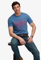 Superdry Vintage Logo Classic Tee in Wedgewood Blue seated model view