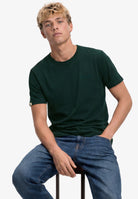 Superdry Essential Company Logo Tee in Forest Green/Deep Green seated model view