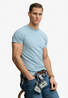 Superdry Essential Company Logo Tee in China Blue/Pink seated model view