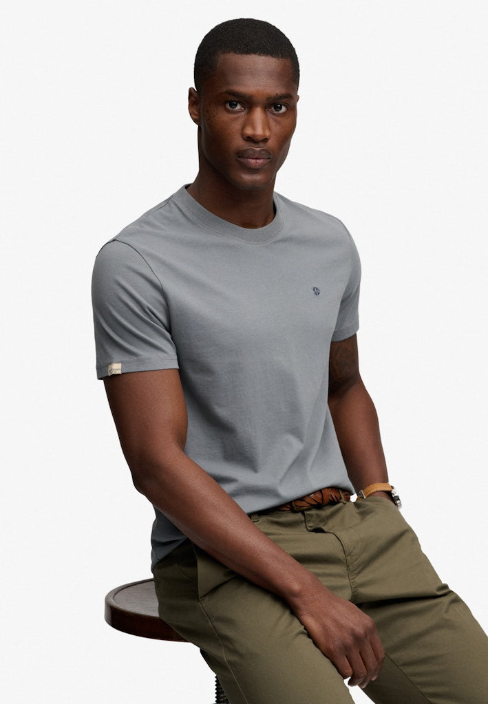 Superdry Essential Sdco Logo Embroidered Tee in Stormy Weather Blue/Navy seated model view