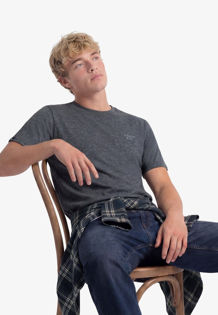Superdry Essential Stacked Logo Embroidered Tee in Eclipse Navy/Grey Feeder/Grey seated model view