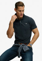 Superdry Vintage Destroy Polo in Eclipse Navy angled model view