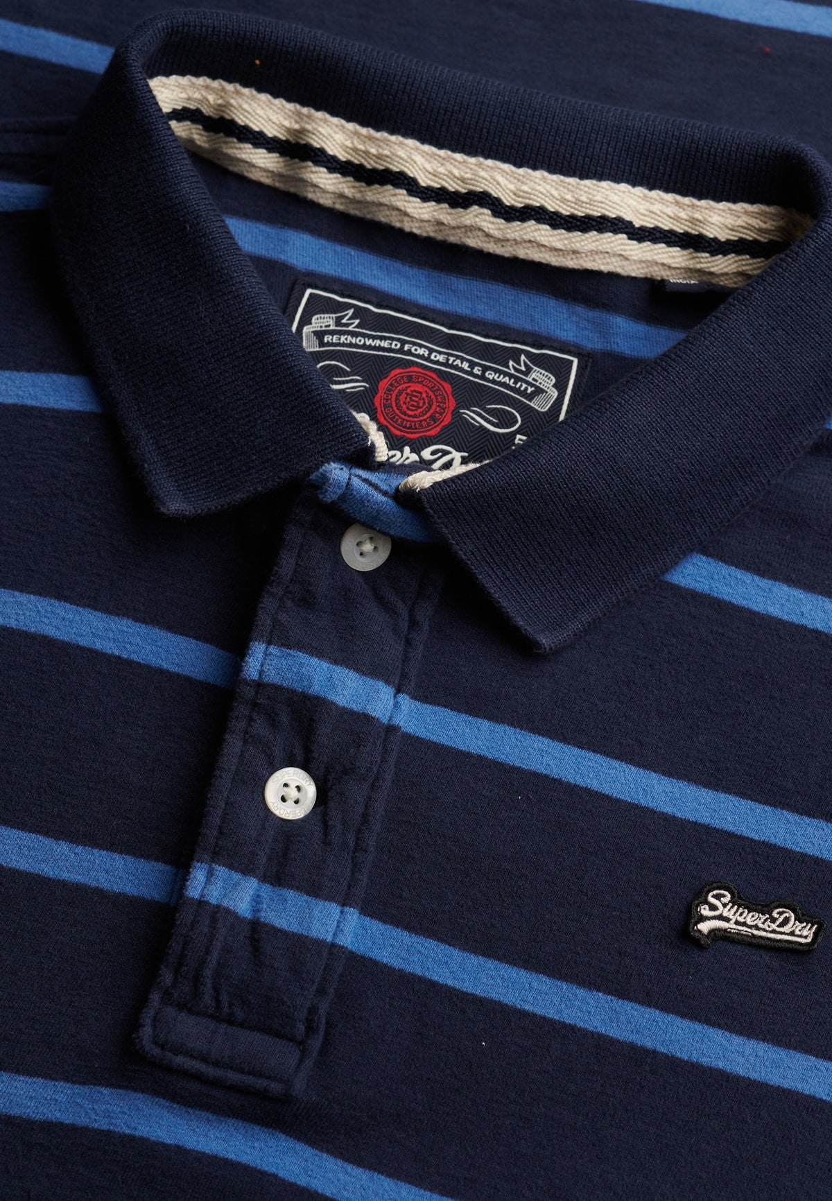 Superdry Vintage Stripe Jersey Polo in Navy Blue Stripe collar and button placket detail